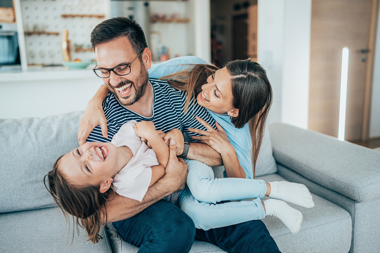 Parents and child laughing