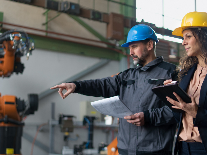 Commercial Business Owners Reviewing Equipment