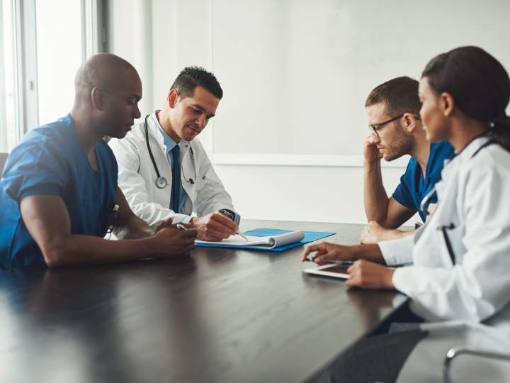 Group of dentists meeting at conference table