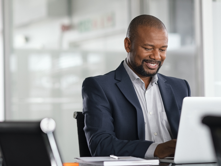 Man reviewing finances at computer