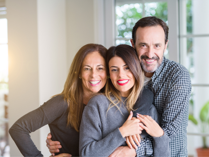 Smiling family - parents and daughter
