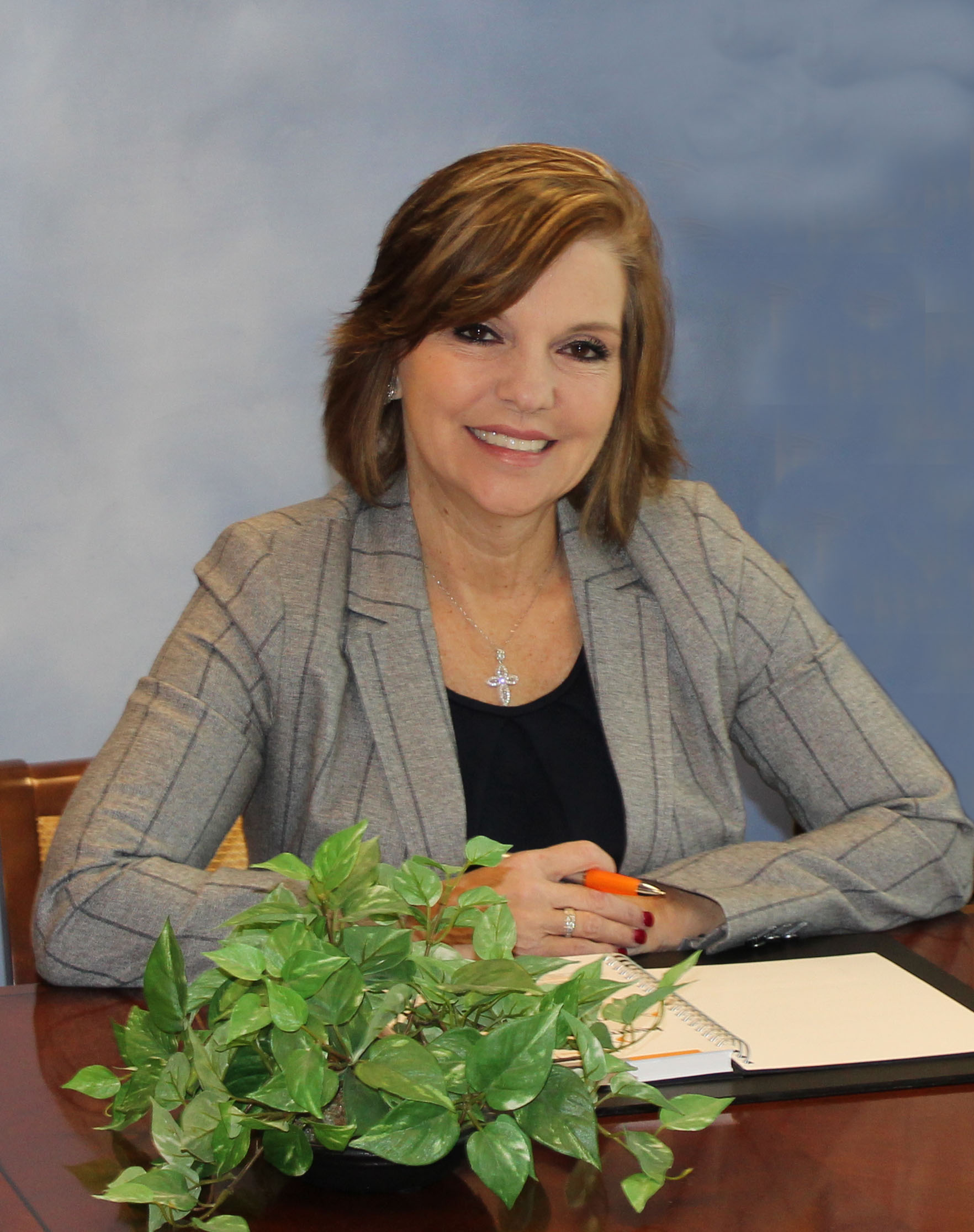 Portrait of a branch manager in a professional setting with a calm demeanor