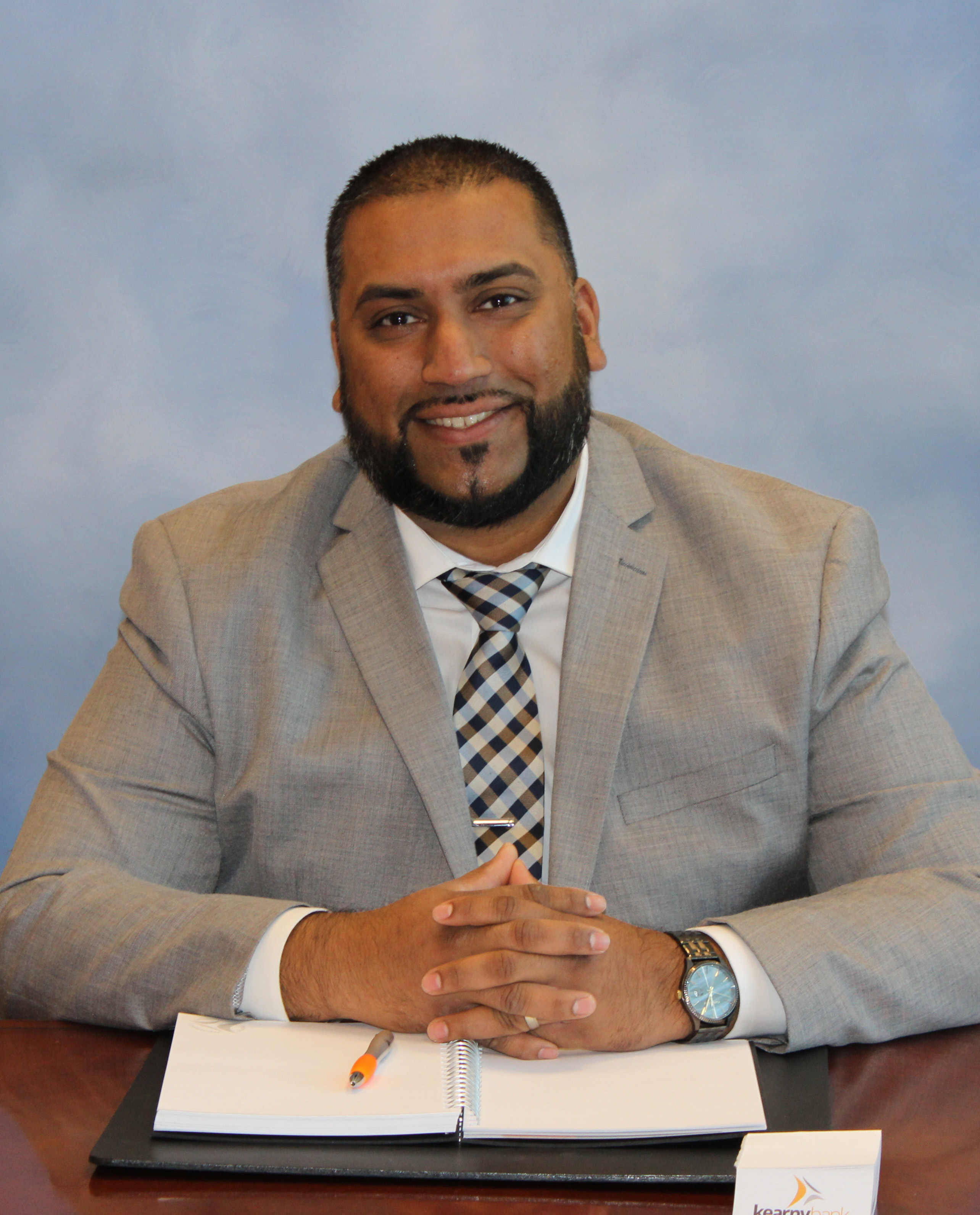 Branch manager in office attire, captured for a professional photo