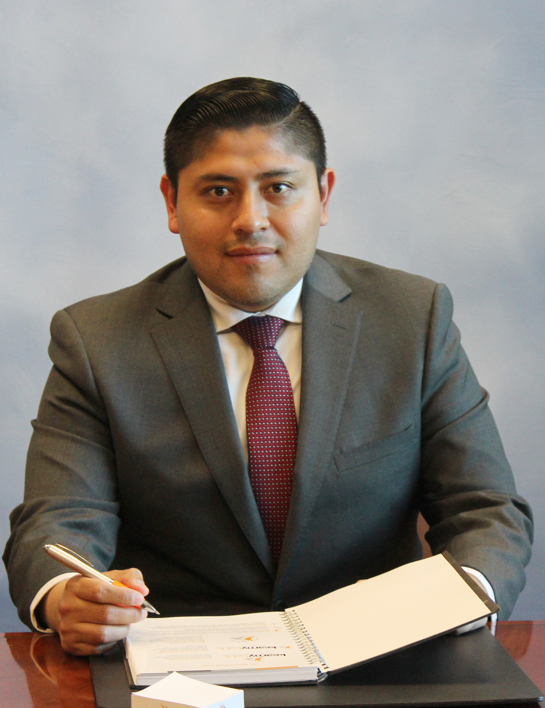 Close-up portrait of a branch manager with a neutral backdrop