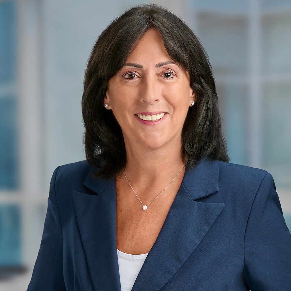Headshot of a branch manager in a well-lit office environment