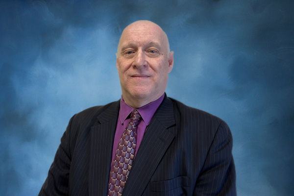 Branch manager headshot with a formal background