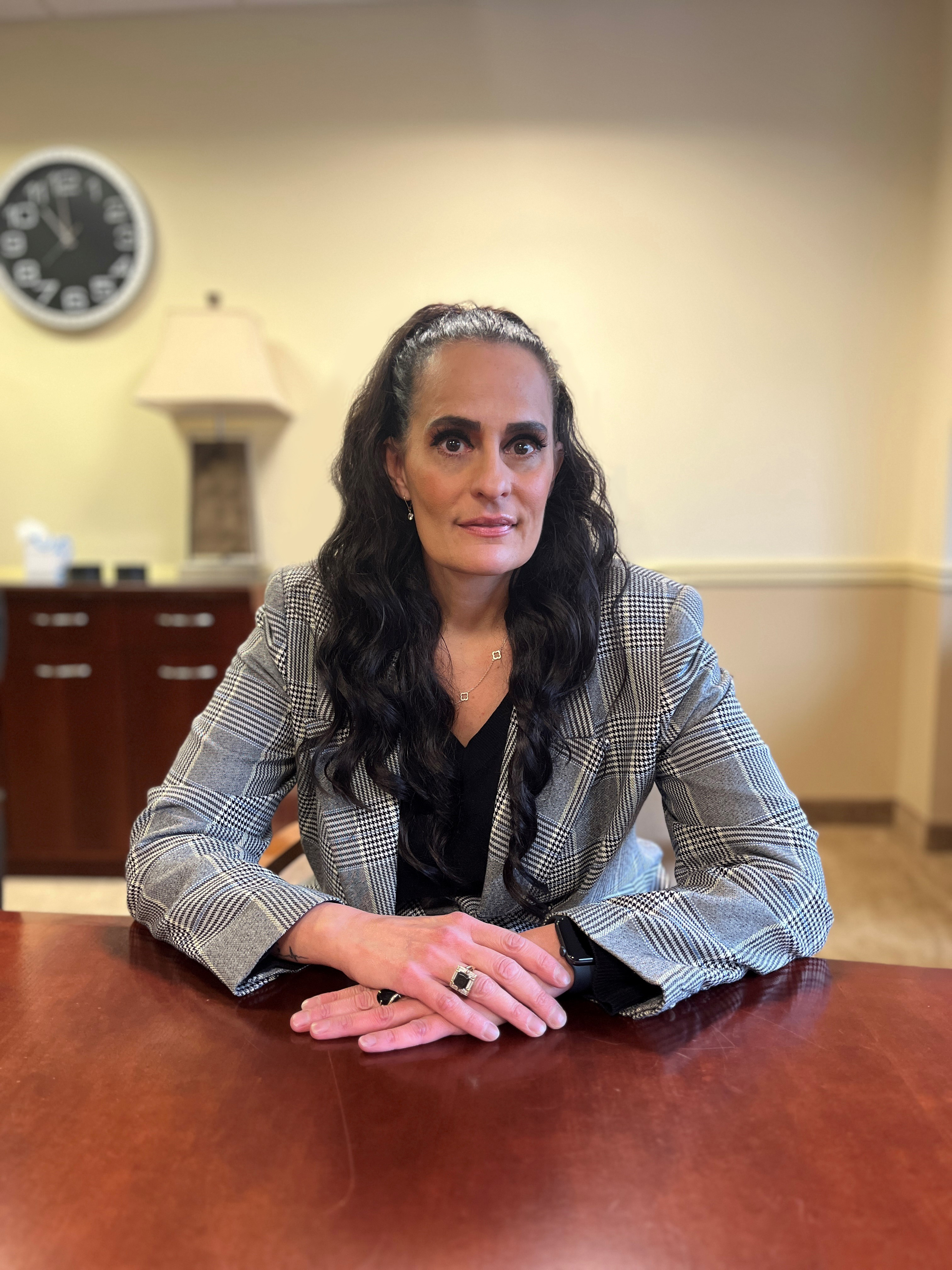 Headshot of a branch manager in a professional office environment