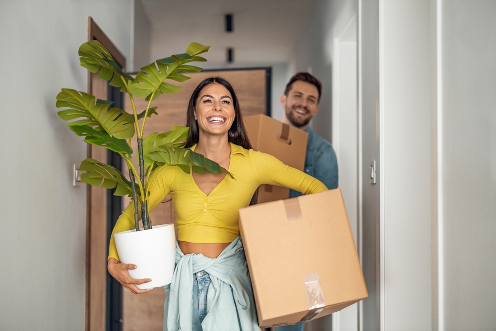 New Homeowners with Moving Boxes