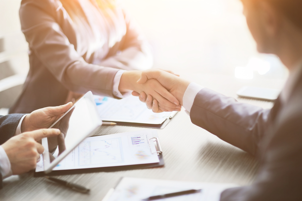 1031 Exchange - Business people shaking hands