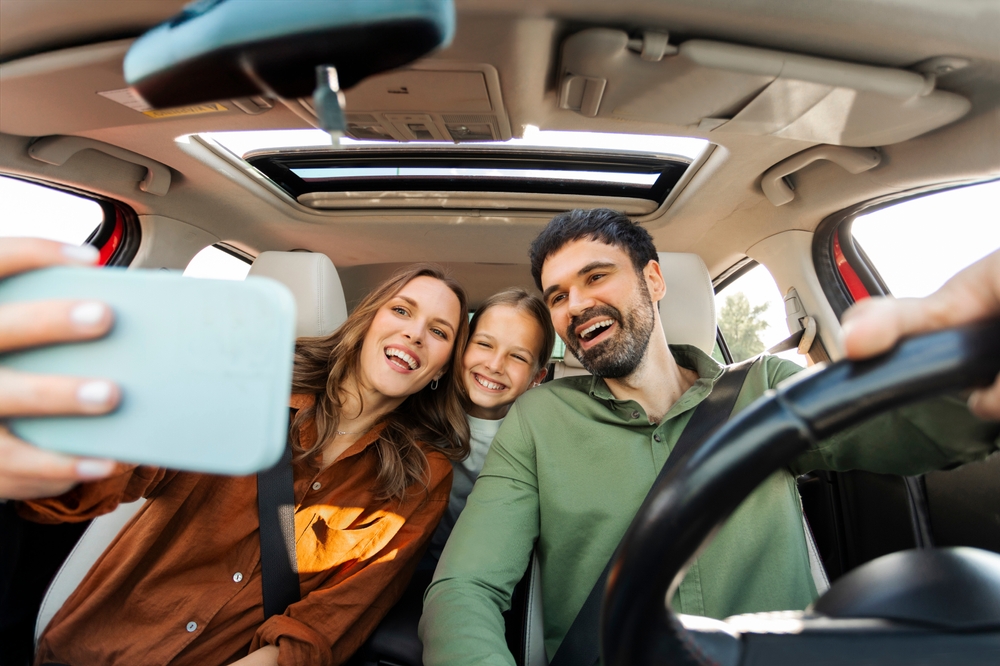 Family Road Trip - Mother, Father, Daughter Selfie