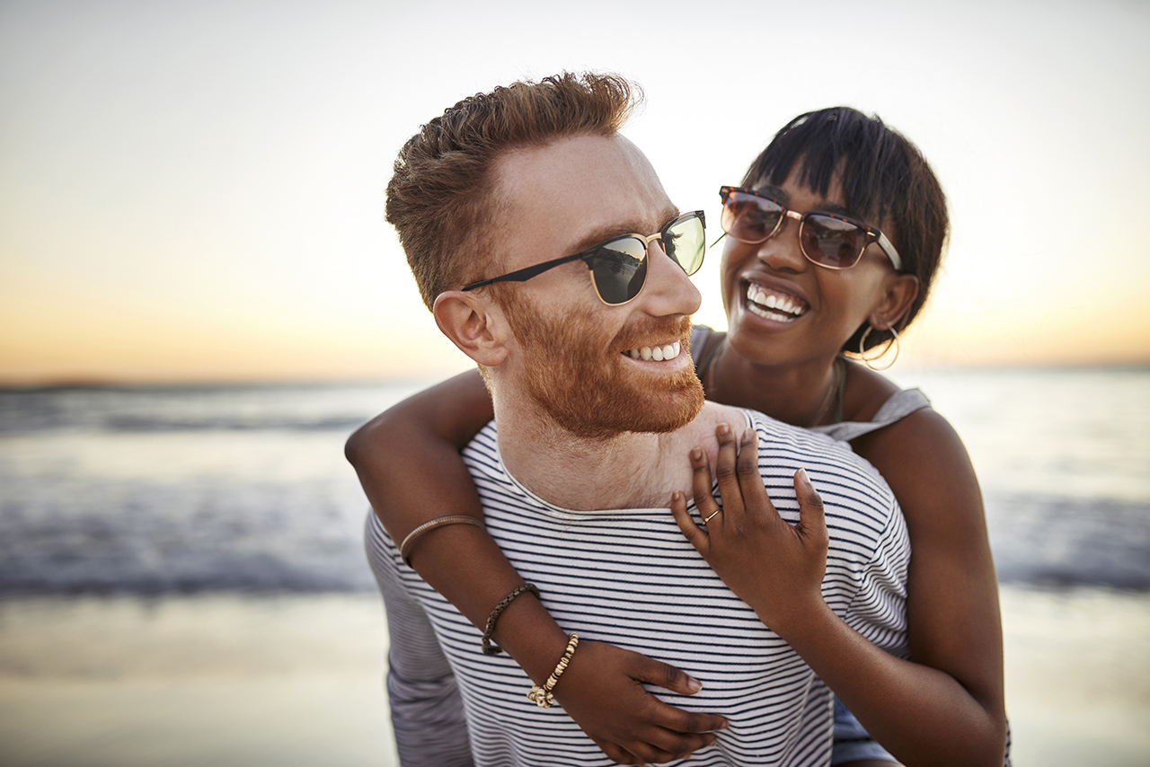 man and women laughing and hugging