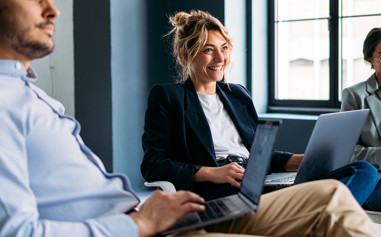 Business professional man and woman in conversation, engaging in discussion