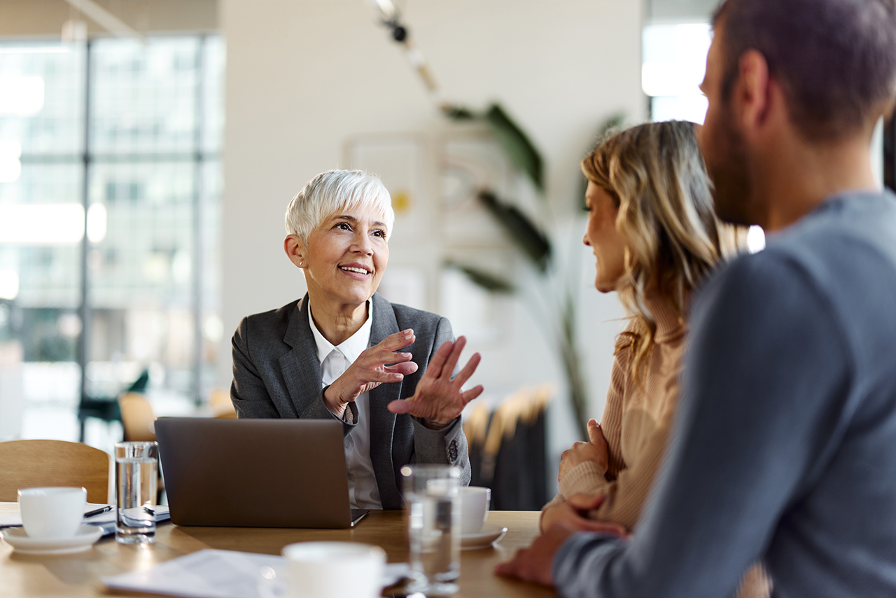 Business professional in conversation, engaging in discussion