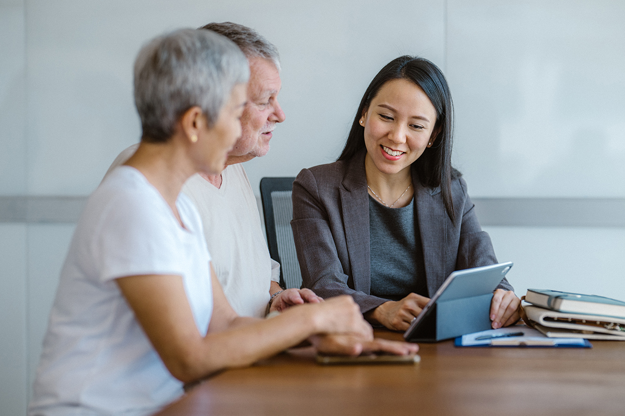 couple sitting at table with business professional