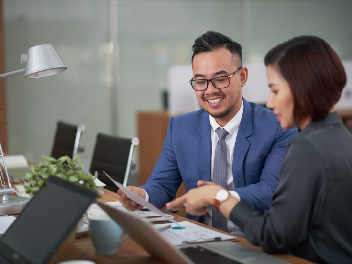 Female banker helping man with his banking relationship