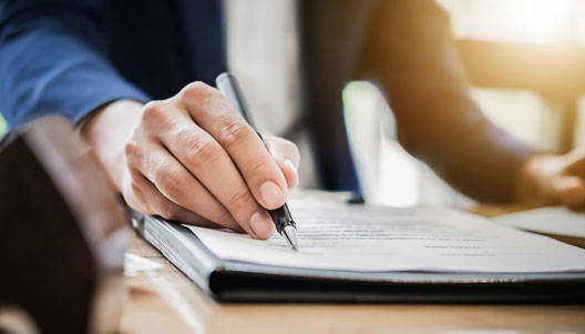 A person signing home mortgage loan papers – Kearny Bank