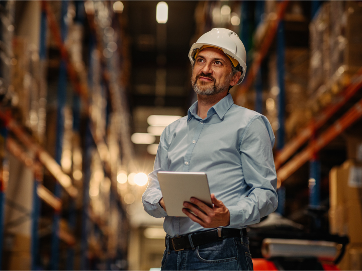 Businessman inspecting a commercial warehouse