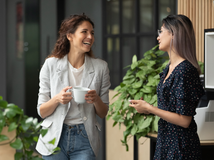 Businesswomen talking to each other over coffee