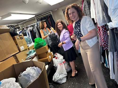 Employees donating clothes